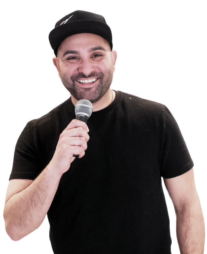 Zahan Sigara laughing with a microphone